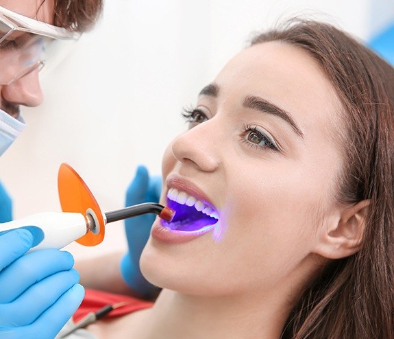 Patient receiving dental bonding treatment