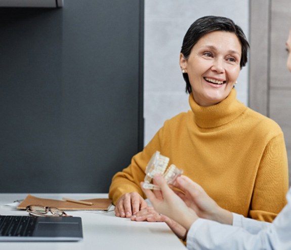 a patient consulting with a dentist