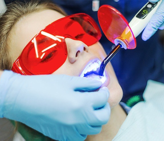 Woman receiving dental bonding treatment