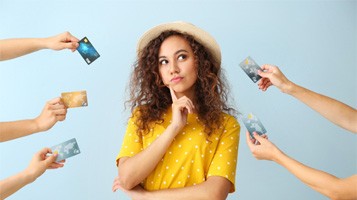 Woman surrounded by credit cards