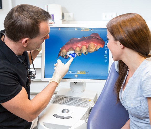 Dentist discussing impressions with female patient