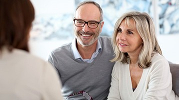 a man with dentures smiling and talking