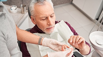 Man at dentist with dentures