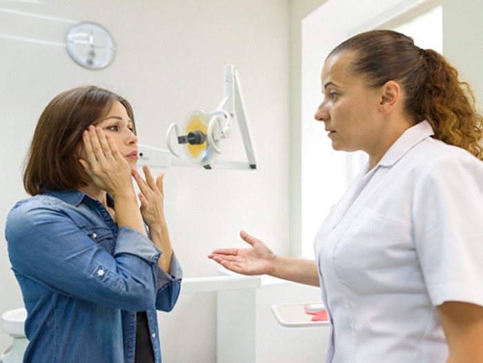 Dentist in Longmont speaking to a patient with dental pain