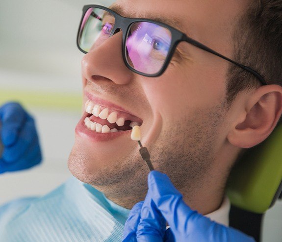 Man reviewing options for single tooth dental implant restoration