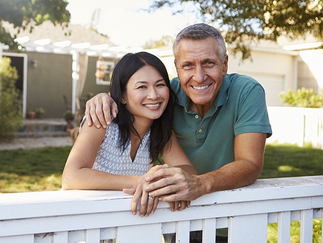 Man and woman smiling outdoors