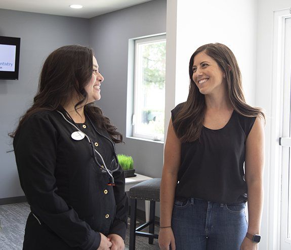 Dental patient smiling at dentist