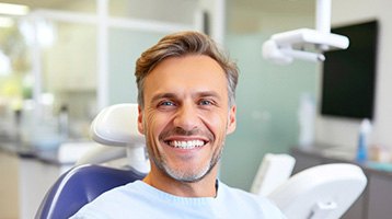 Closeup of man smiling while sitting in treatment chair