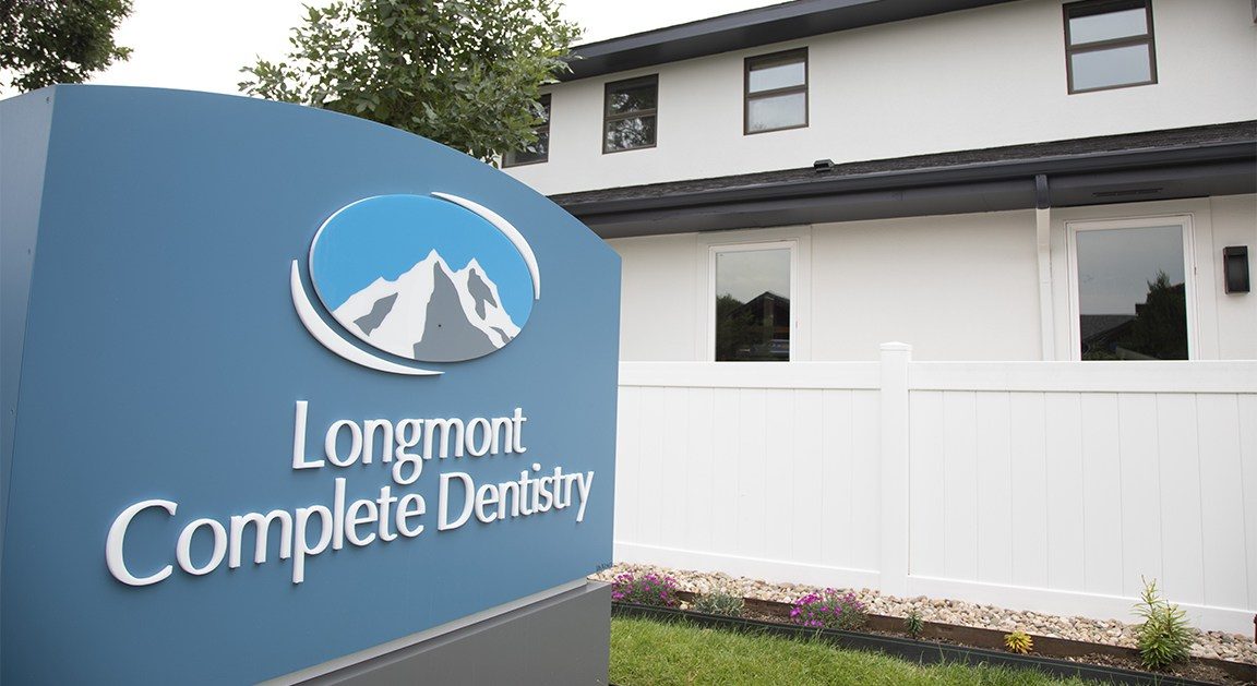 Sign outside of Longmont Complete Dentistry building