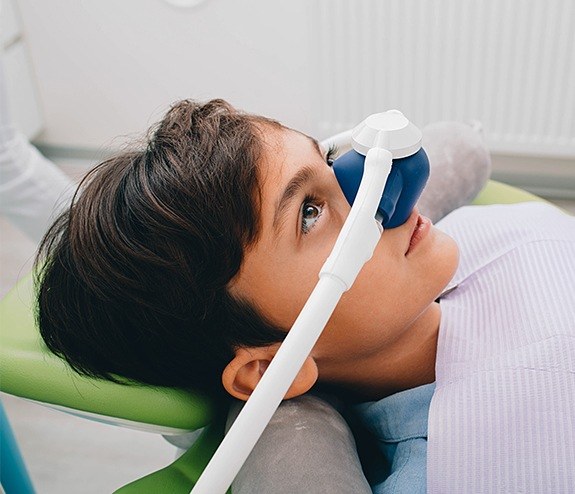 Patient with nitrous oxide dental sedation mask