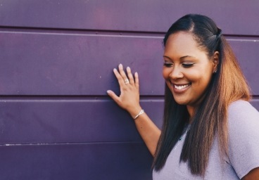 Woman with healthy smile after gum disease treatment