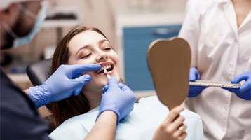 : a patient undergoing the cost of veneers in Longmont