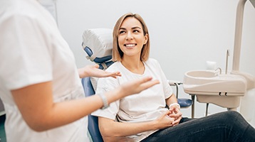 patient talking to cosmetic dentist