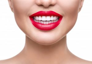 beautiful woman smiling wearing red lipstick