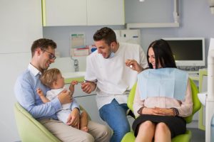 family in a dental chair