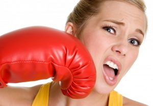 woman getting punched in face with boxing glove