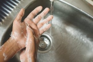 person washing their hands