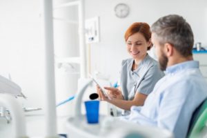 dental hygienist with patient