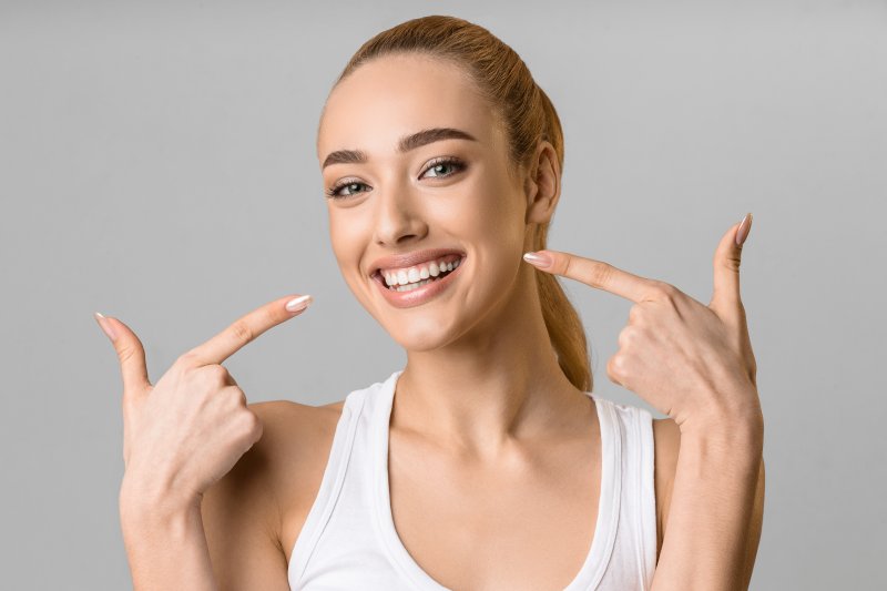 A woman smiling with her new veneers