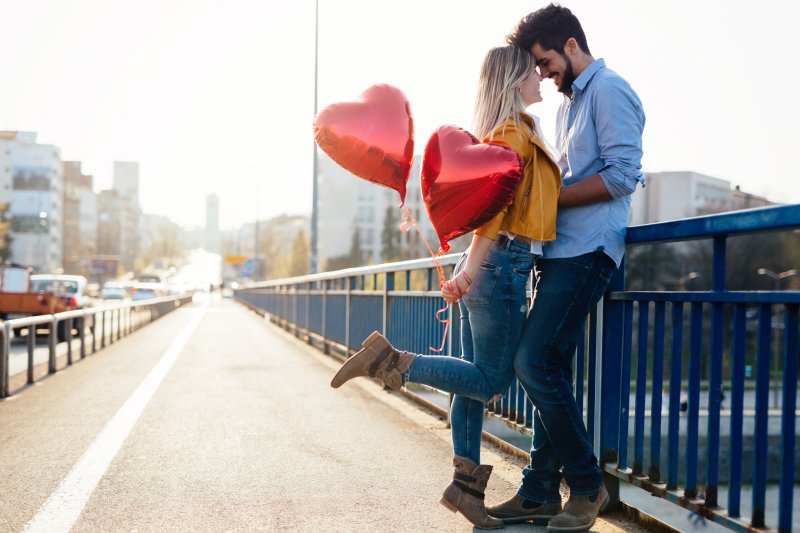 Couple with good oral health smiling for Valentine’s Day