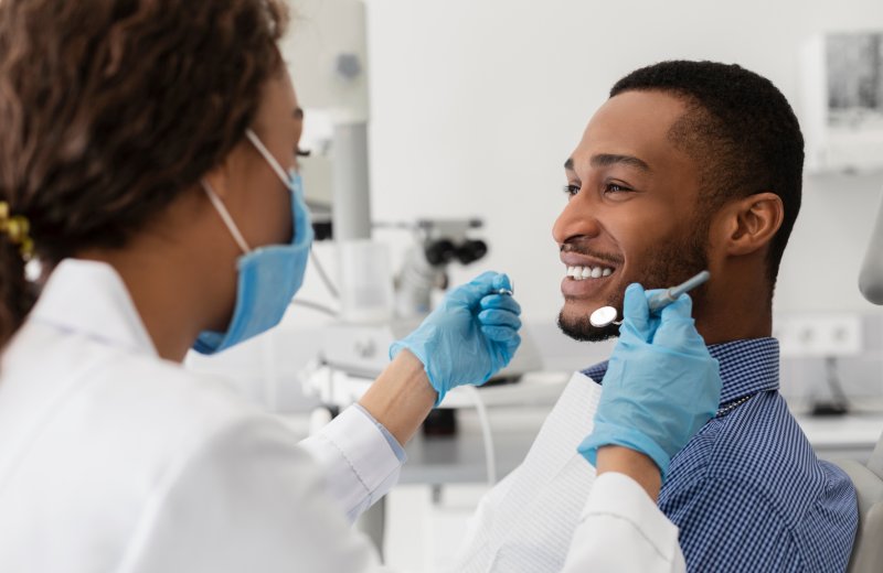Patient smiling with their same-day crown